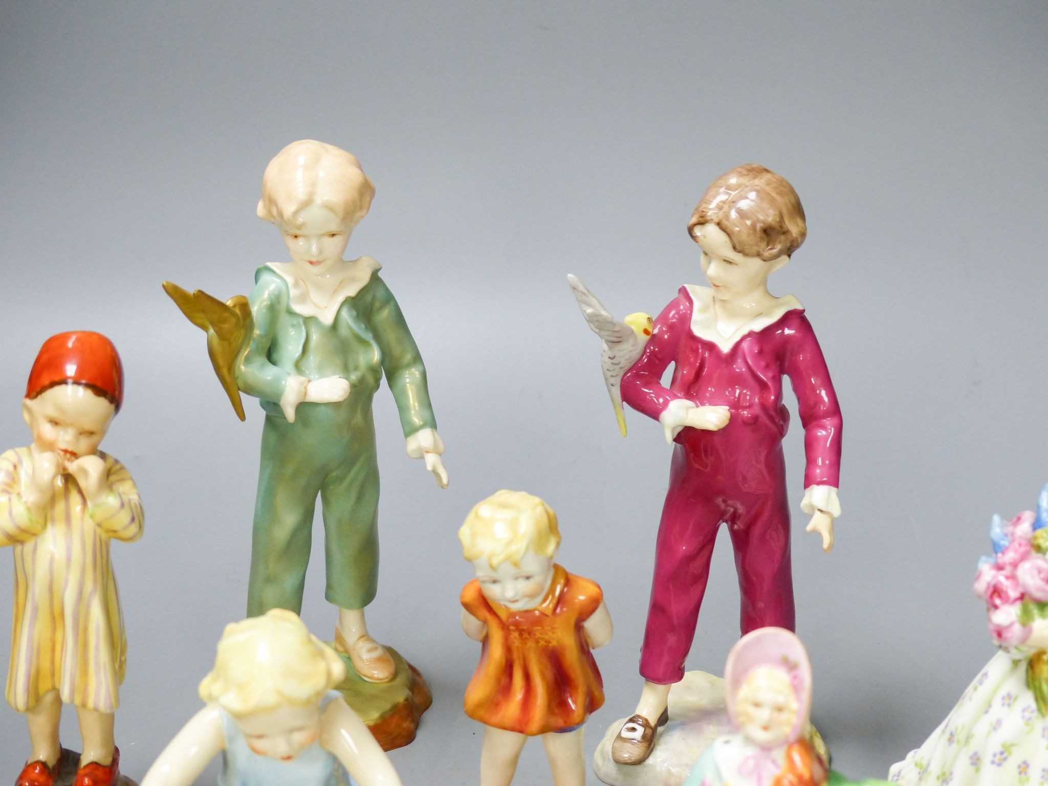 Three Worcester F.G. Doughty figures of children, 4 others and 2 figurines (9)